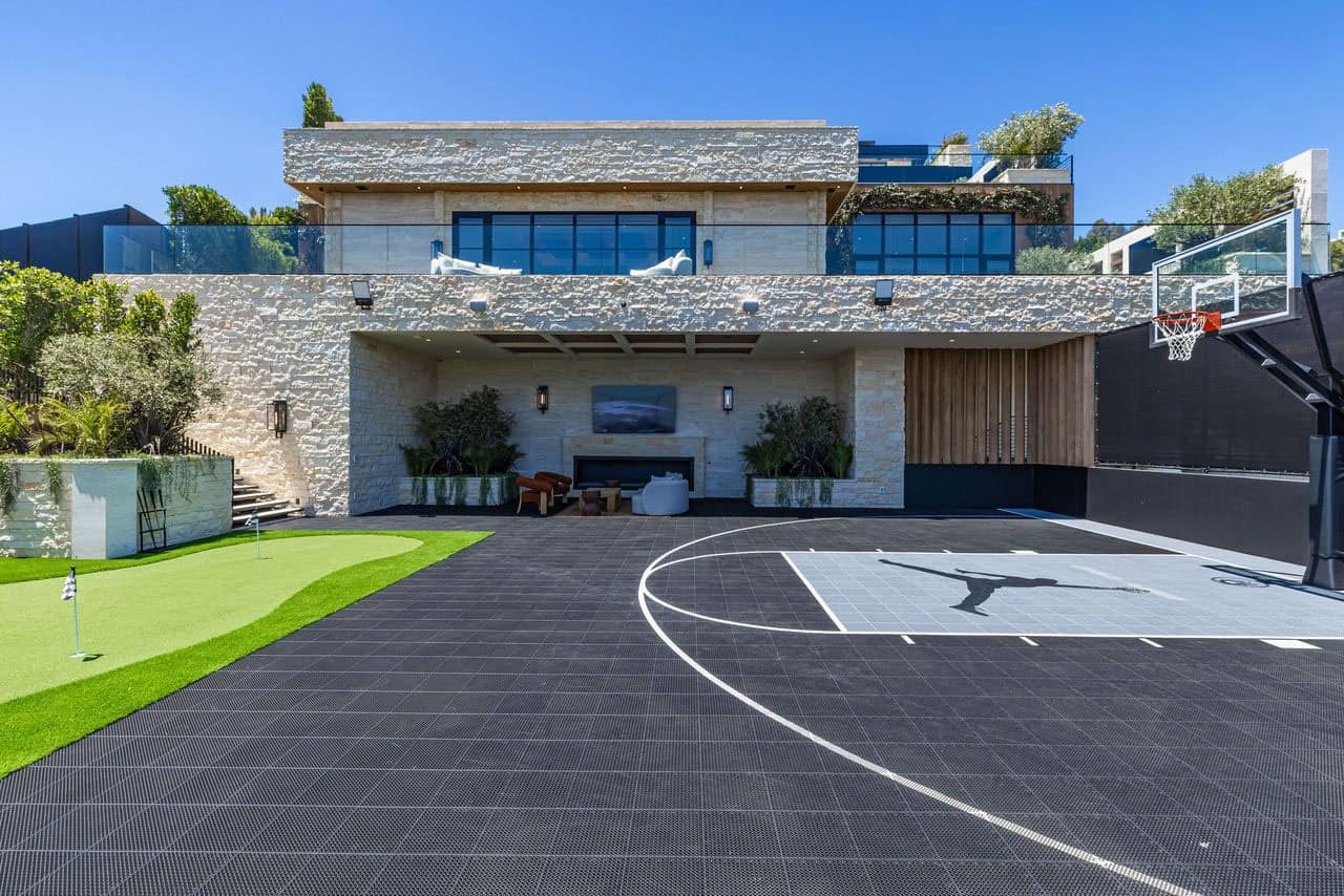 hillside home exterior backyard view with a putting green and basketball court