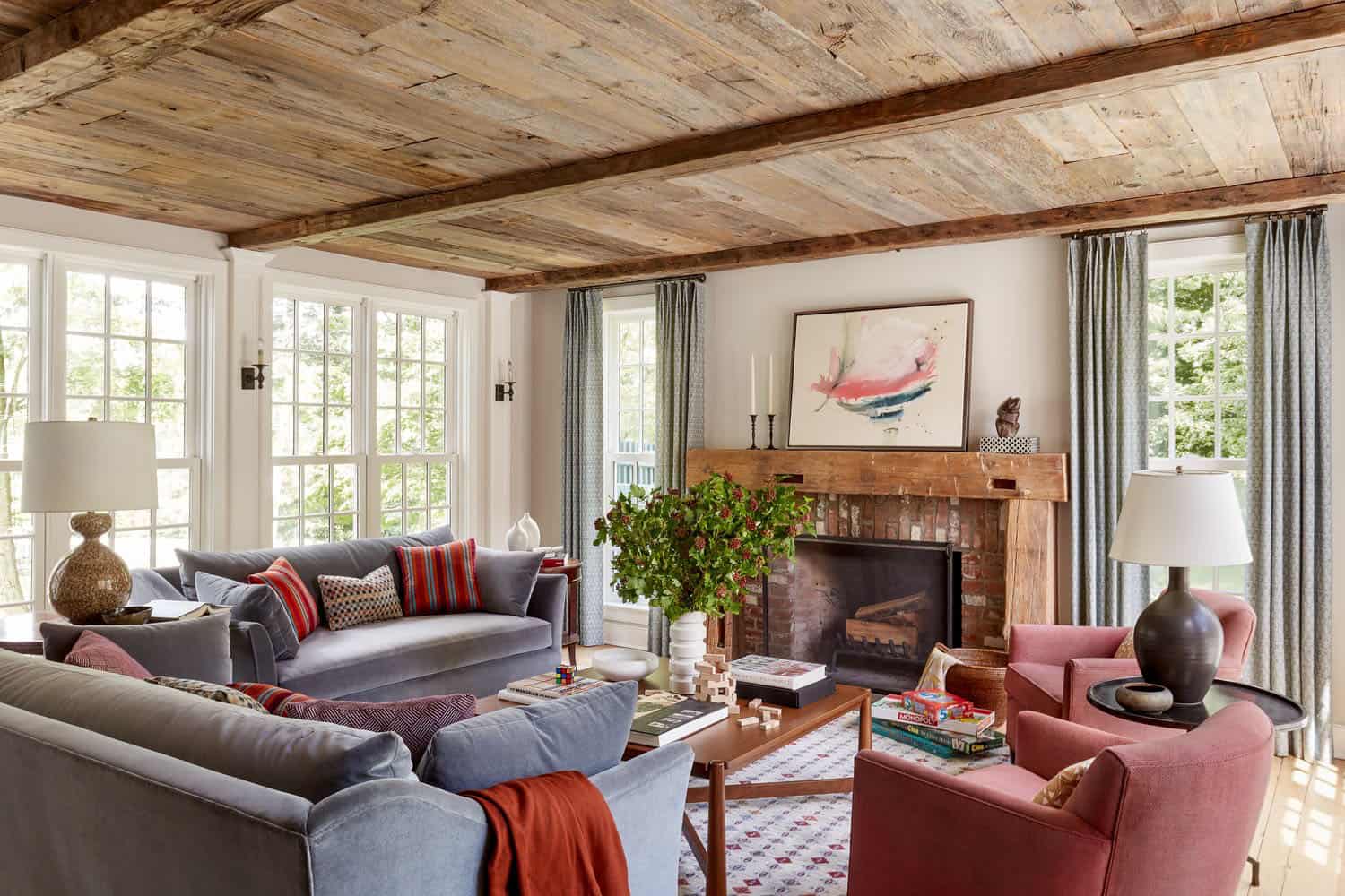 farmhouse style family room with a fireplace