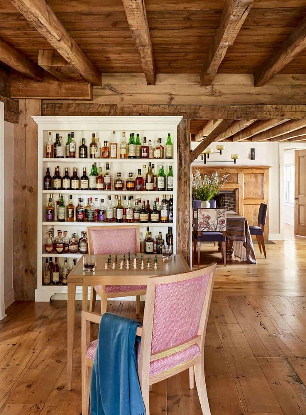 farmhouse style hoem bar with a table and chairs