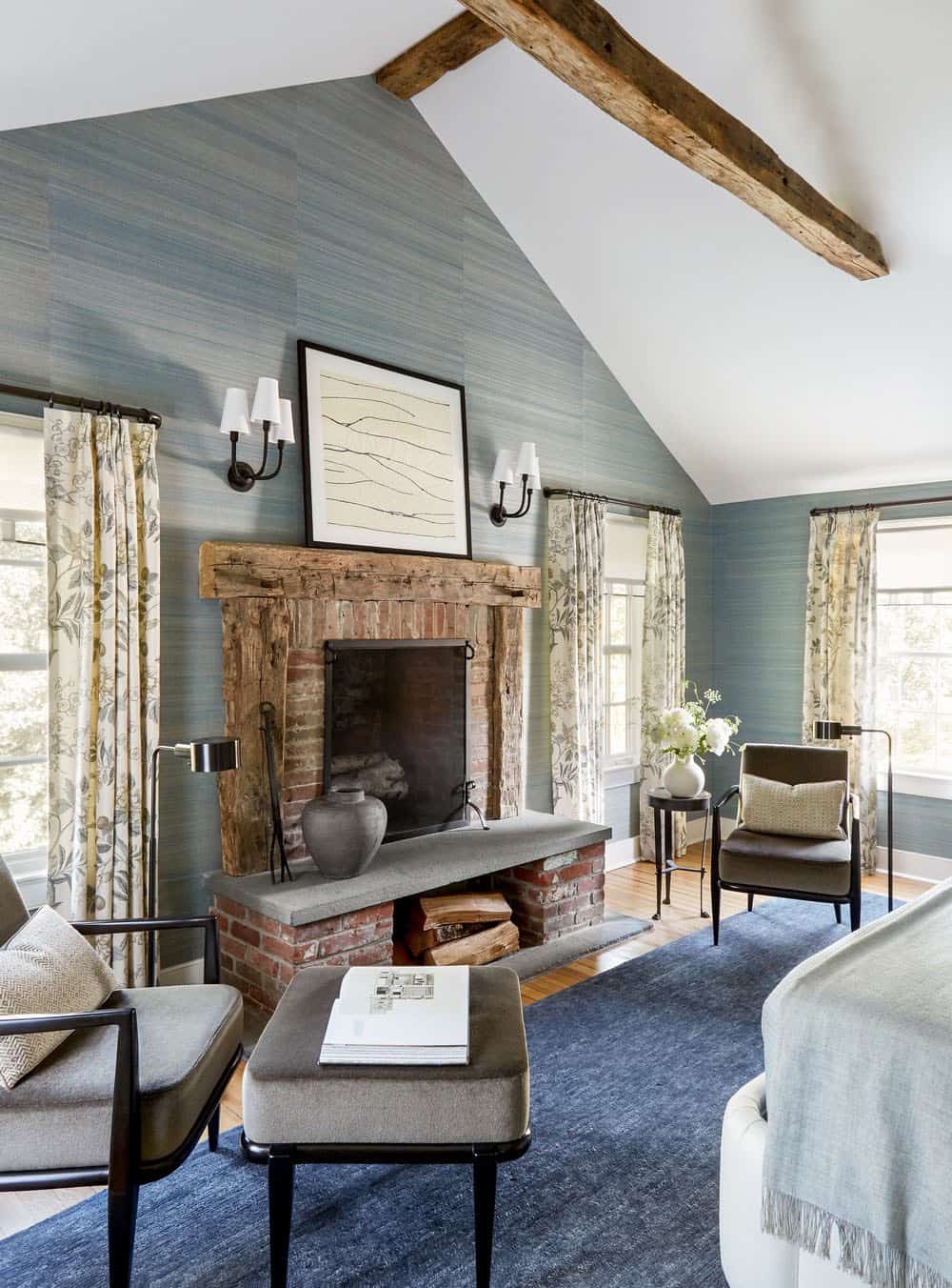 farmhouse style bedroom with a fireplace