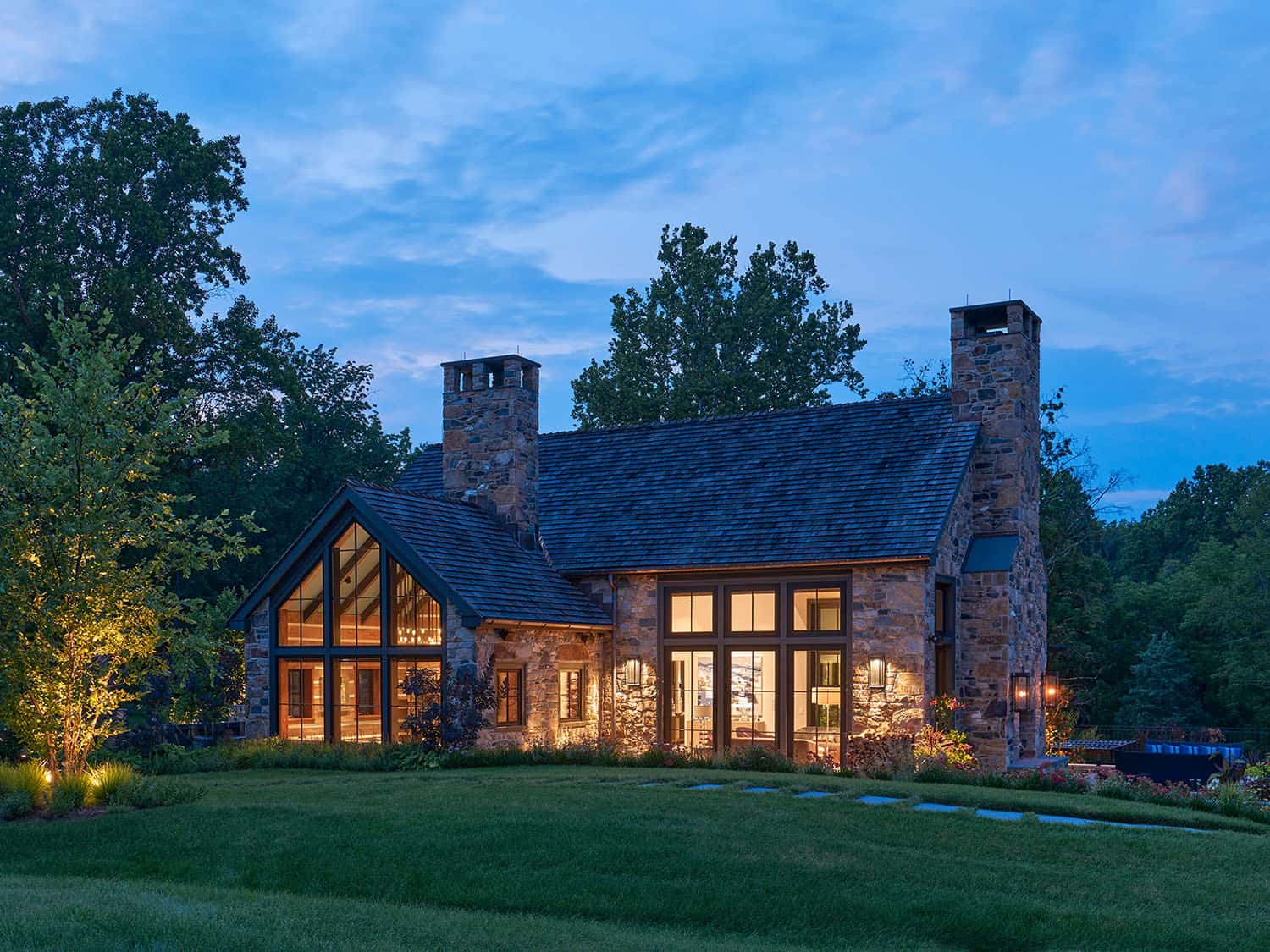 contemporary farmhouse home exterior at dusk