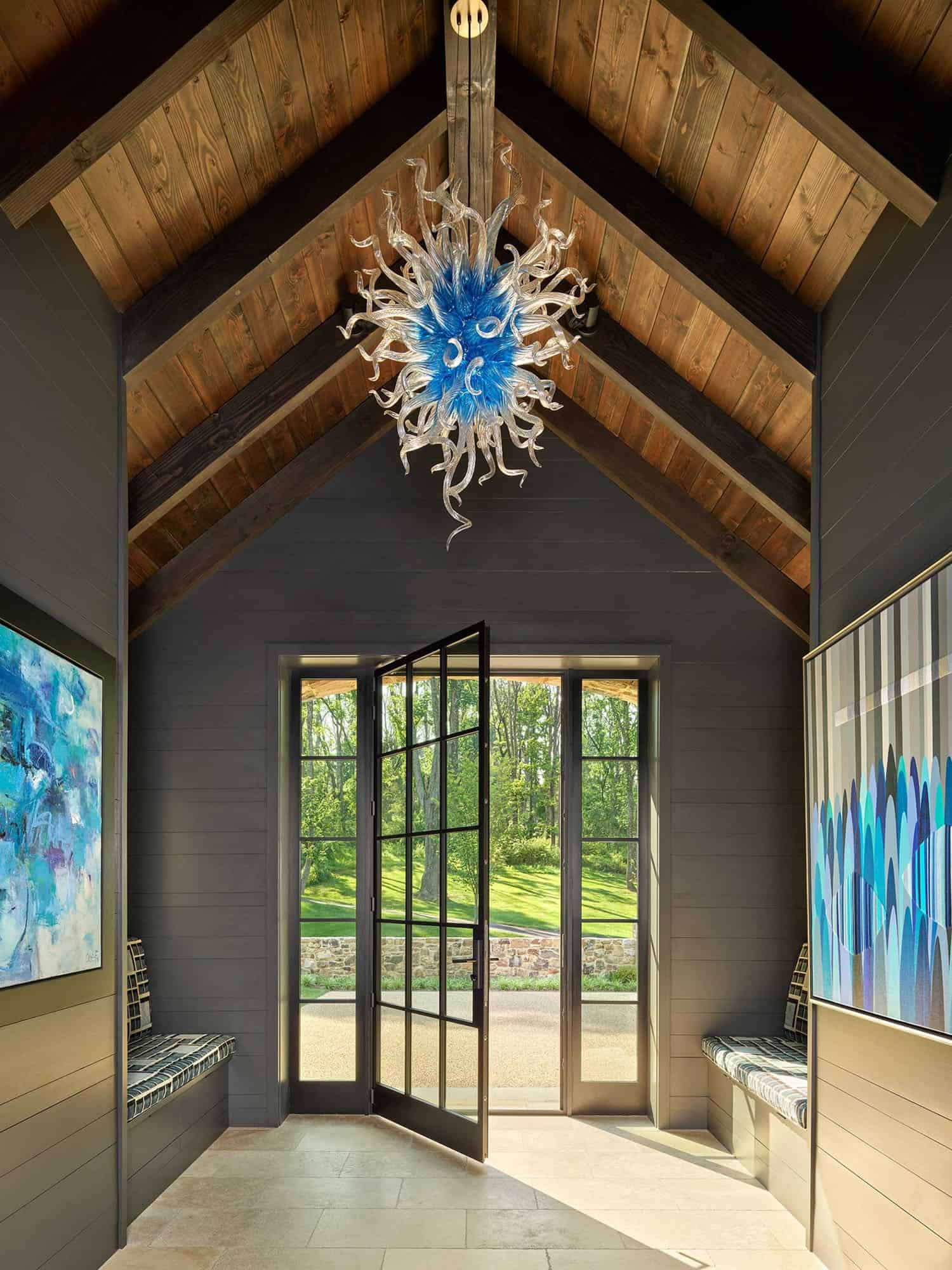 contemporary farmhouse home entry with a vaulted ceiling