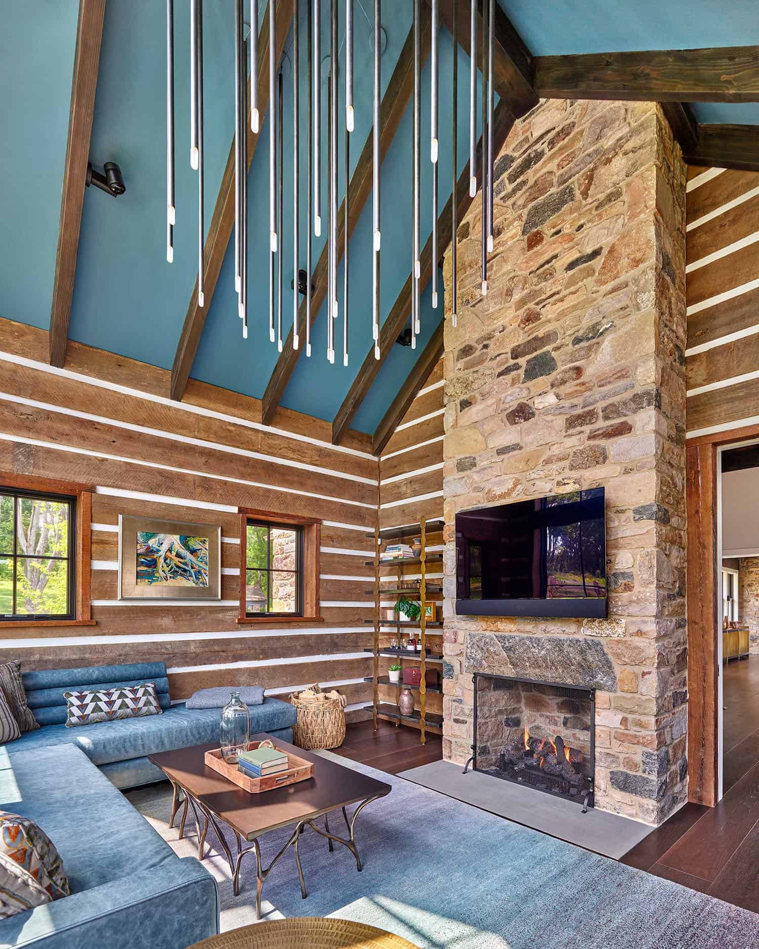contemporary farmhouse style family room with a fireplace