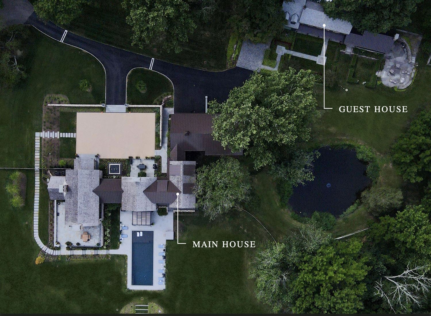 contemporary farmhouse style home and guest house aerial view