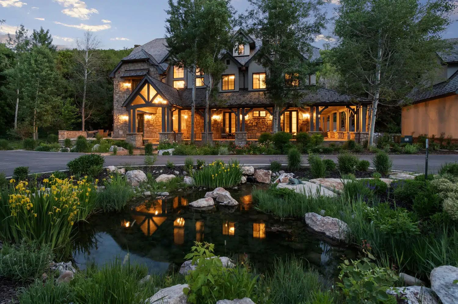 contemporary french country home exterior at dusk