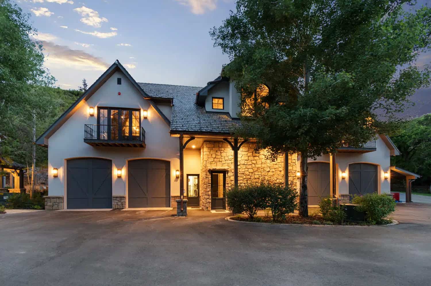 contemporary french country home exterior at dusk