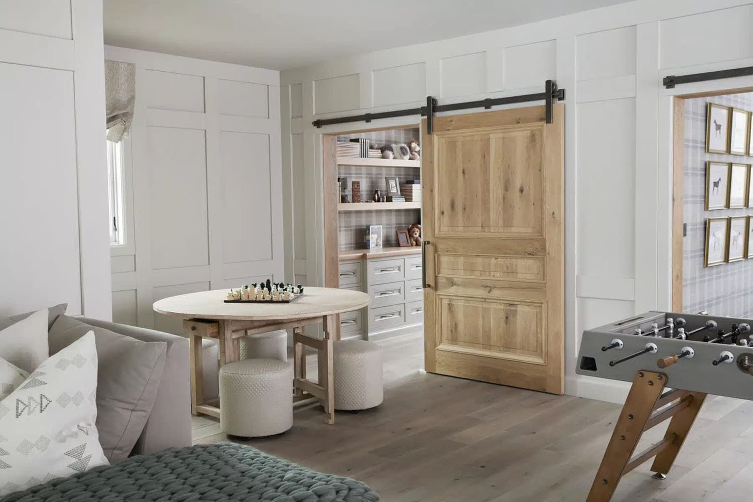 contemporary french country family room with a sliding barn door