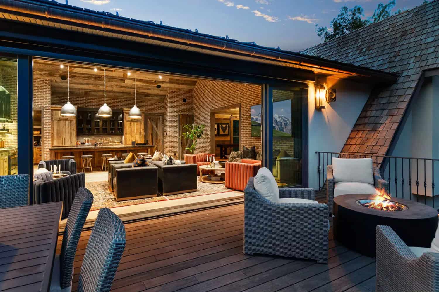 contemporary french country exterior with a deck and outdoor furniture