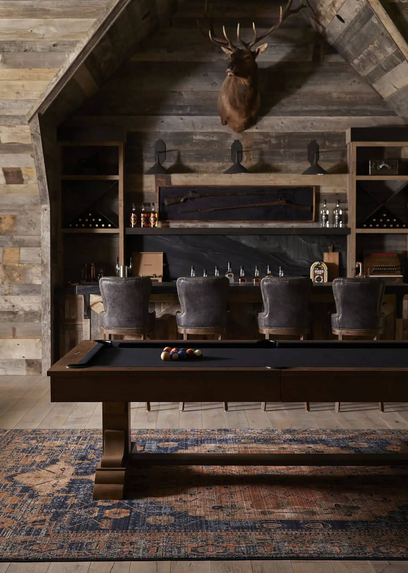 rustic speakeasy-style family room with a pool table