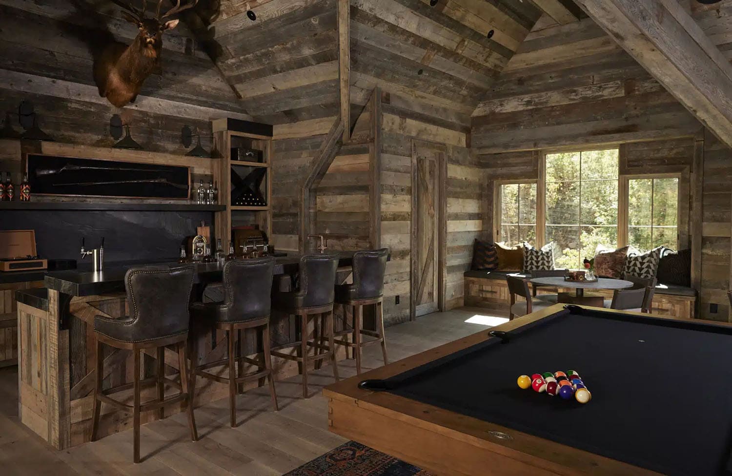 rustic speakeasy-style family room with a pool table