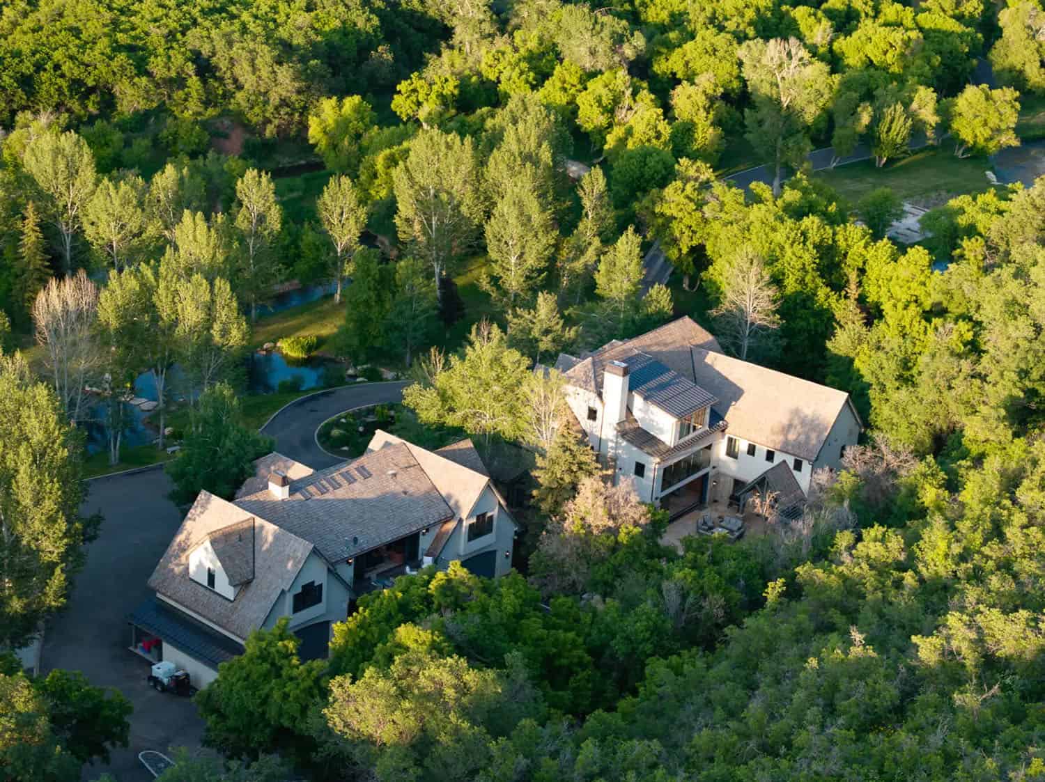 contemporary french country home exterior aerial view