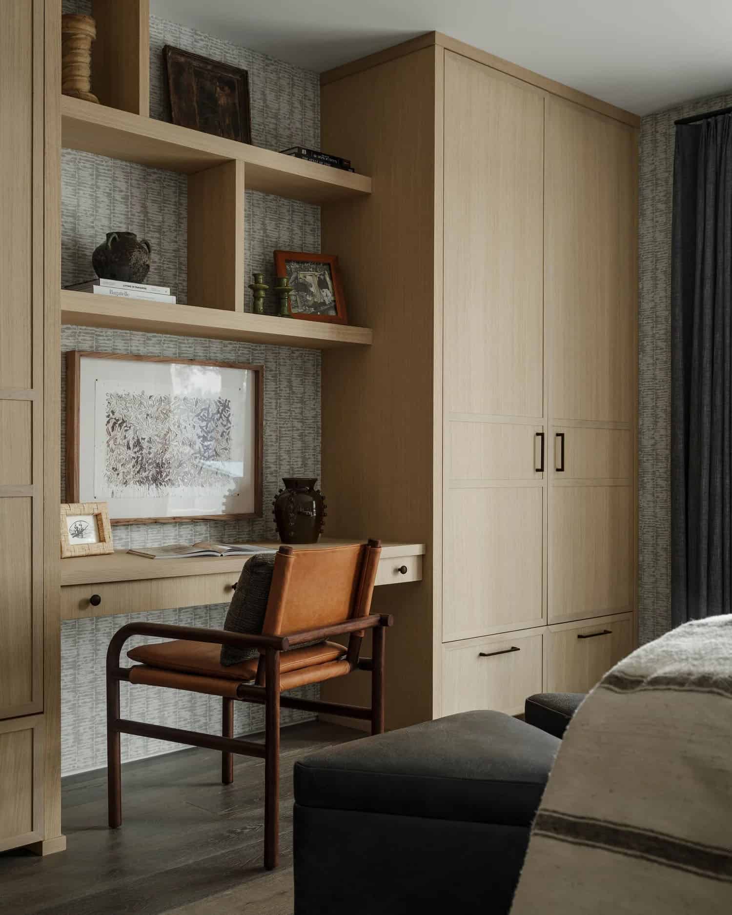 contemporary bedroom with a built-in desk and chair