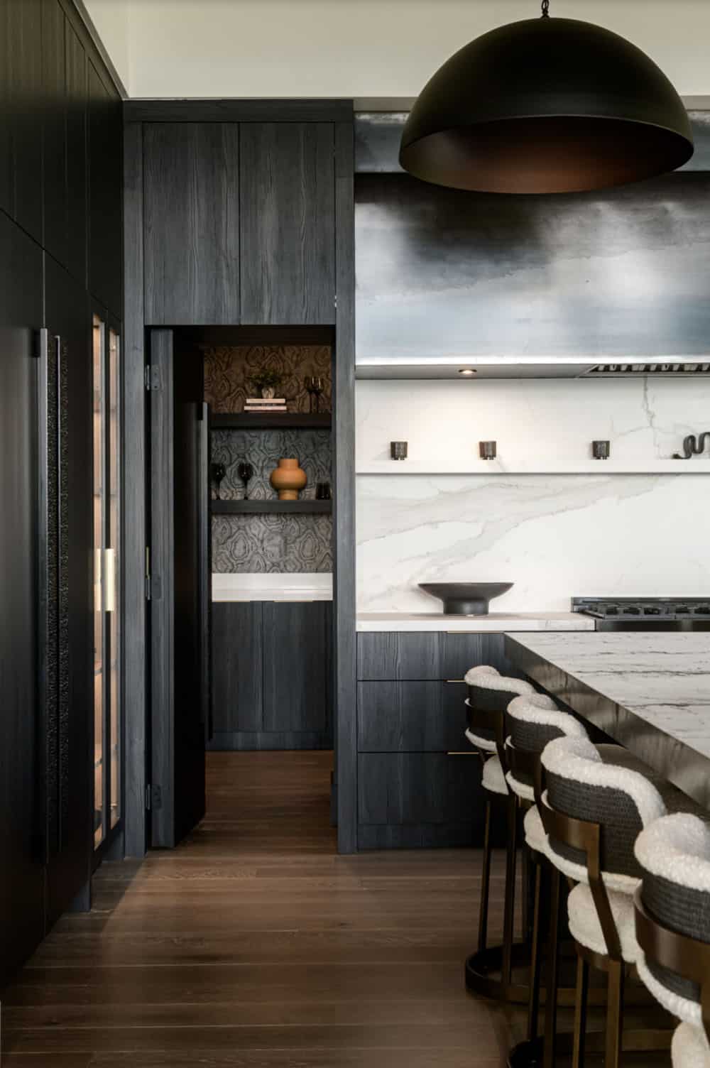 contemporary kitchen with a door leading into the pantry