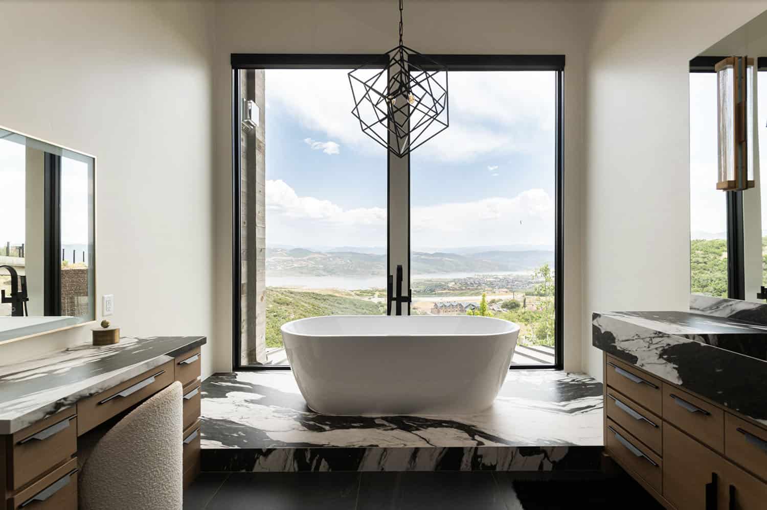 contemporary bathroom with a freestanding tub and large window