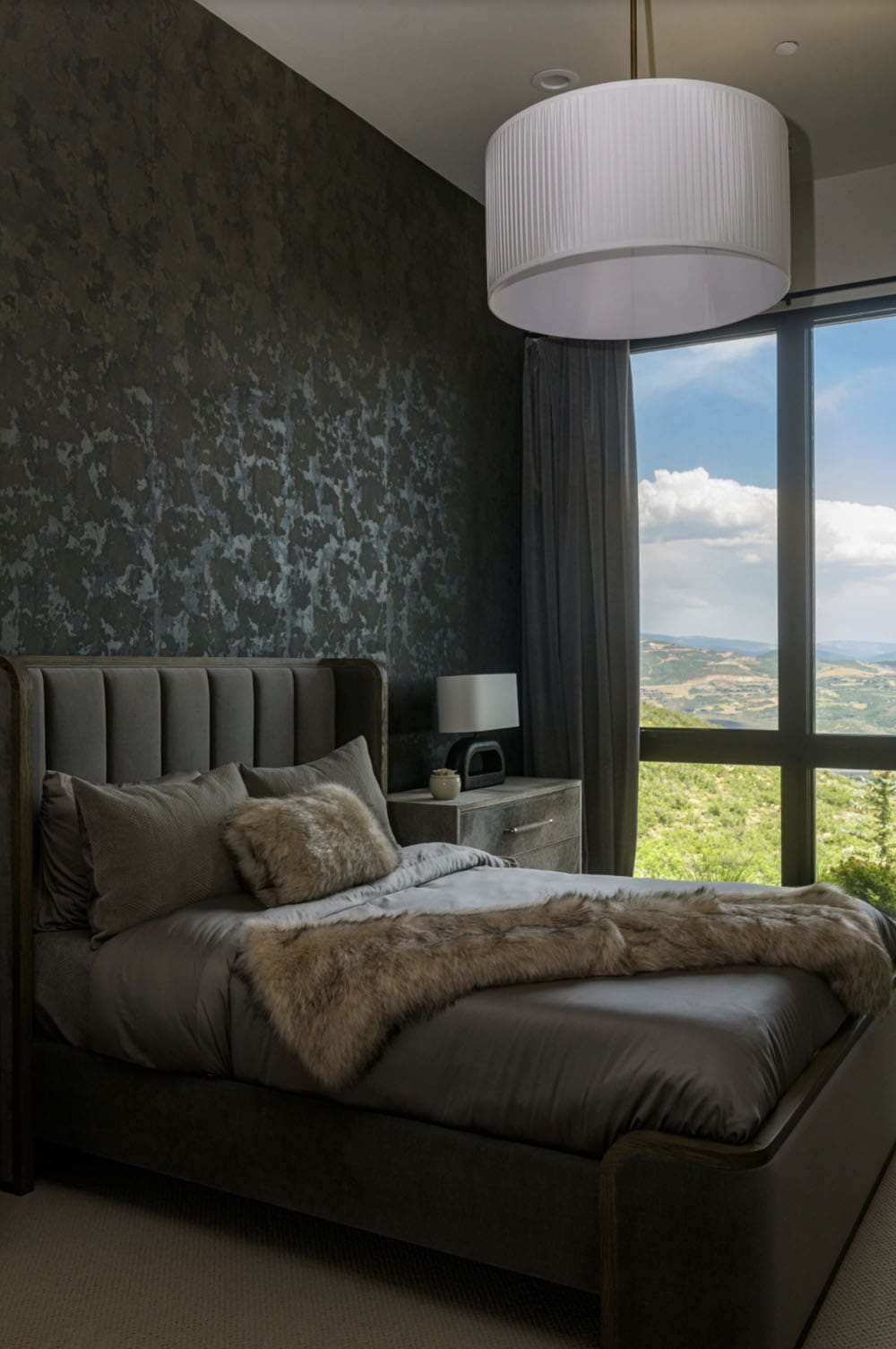 contemporary bedroom with a large window