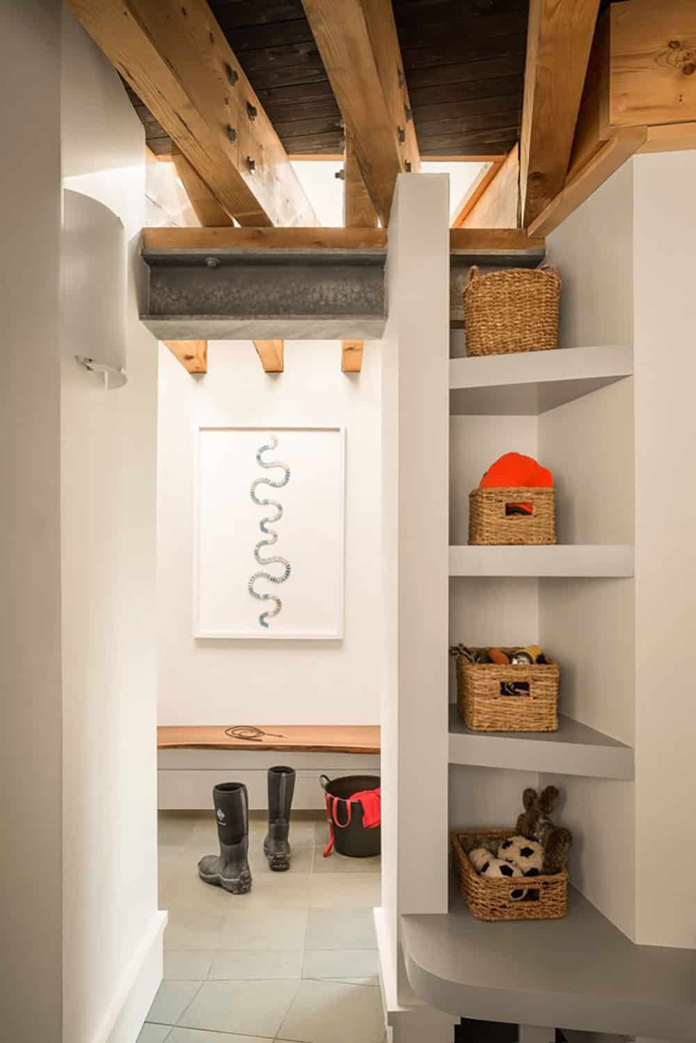 modern coastal home entry with a bench and shelf storage