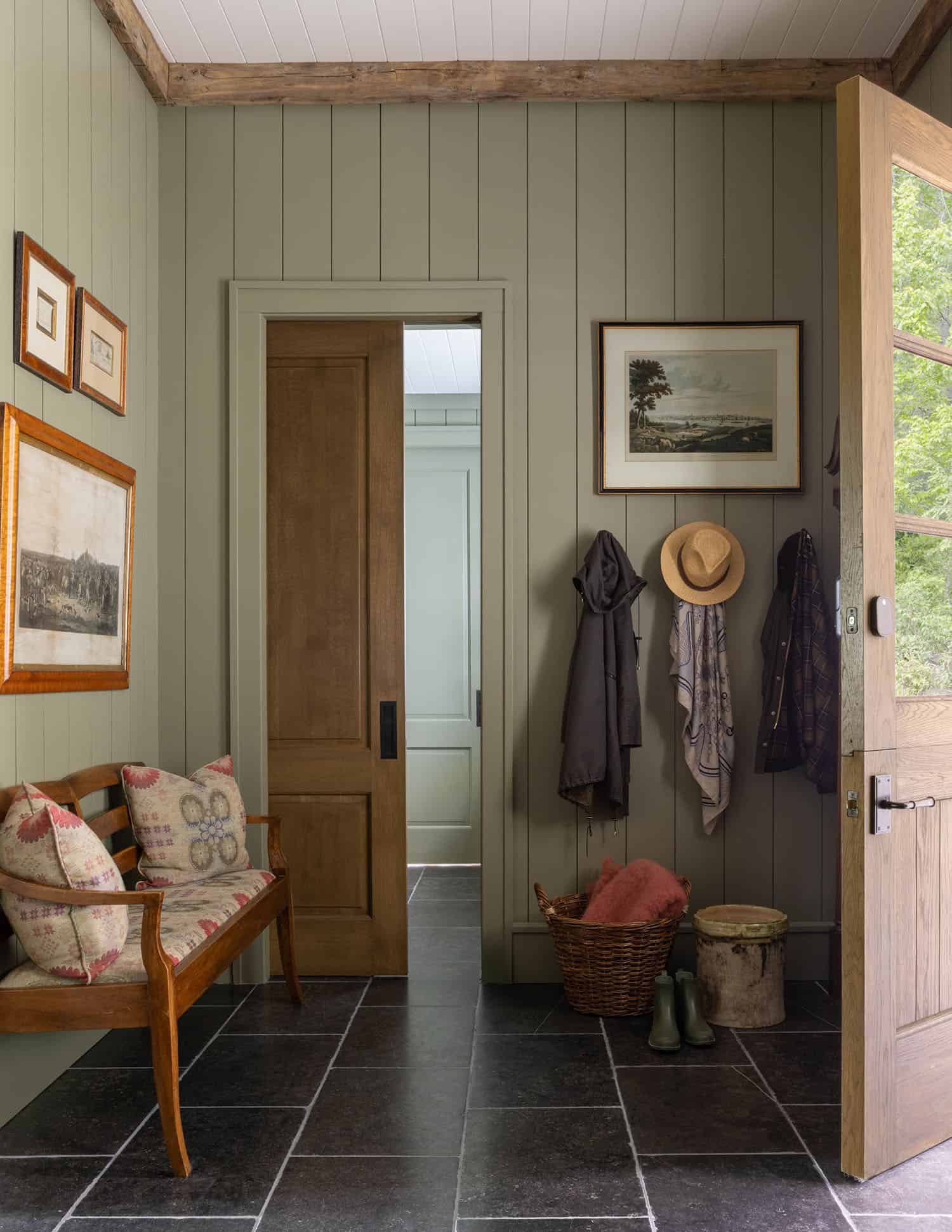 transitional style mudroom entry with a bench