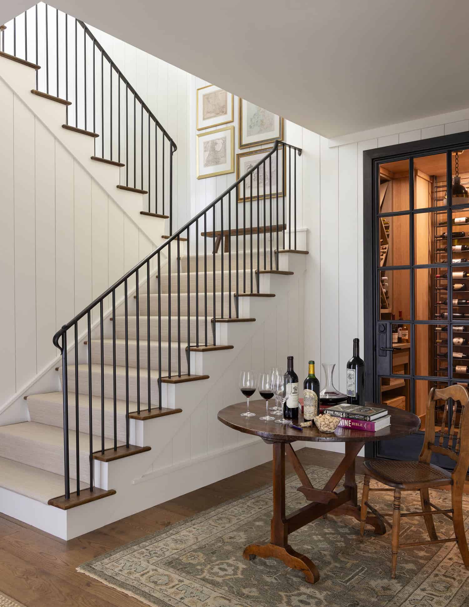 transitional style staircase with a wine cellar