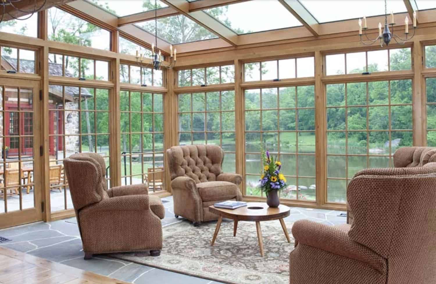 rustic sunroom with a water view