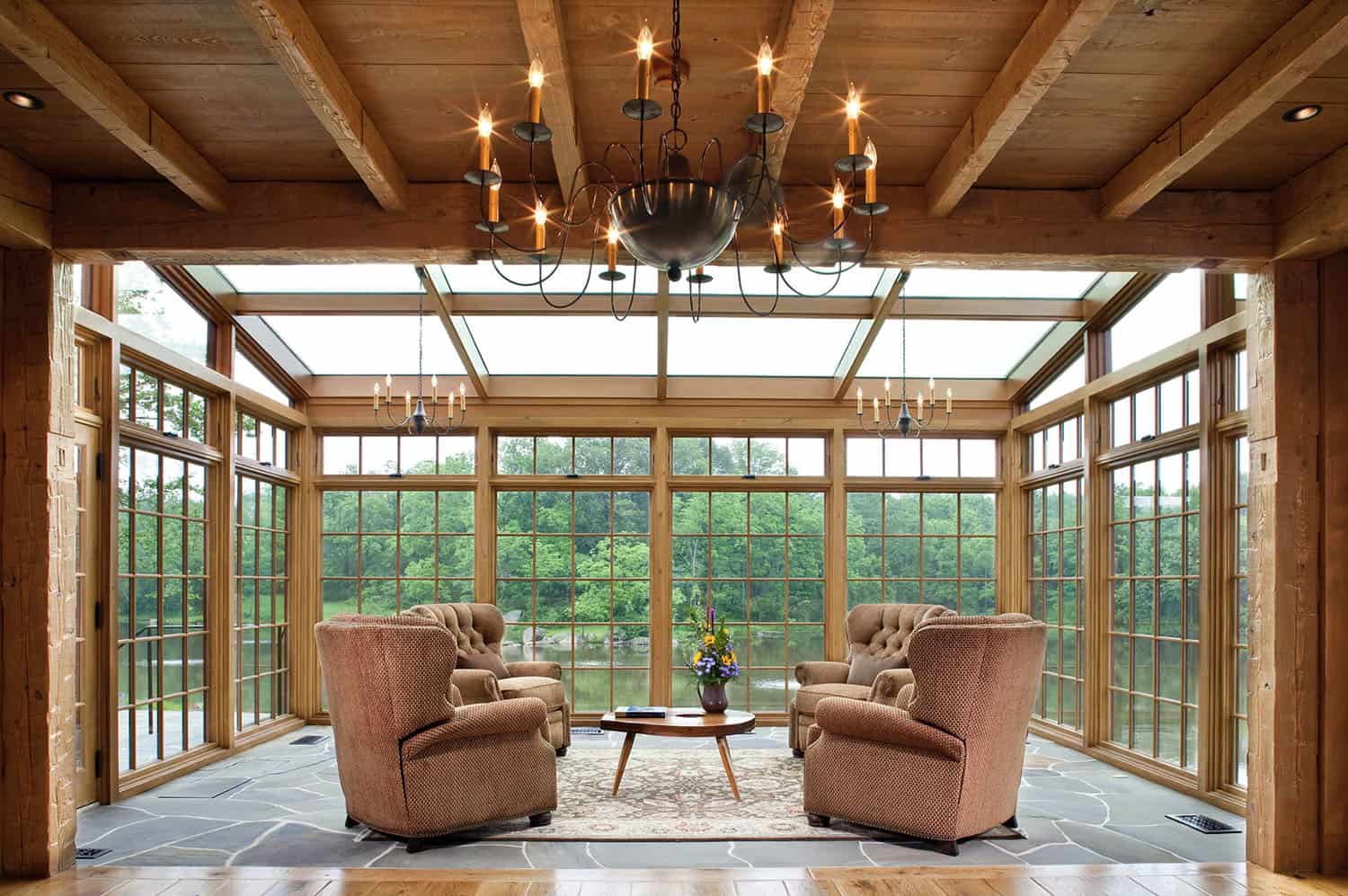 rustic sunroom with a water view