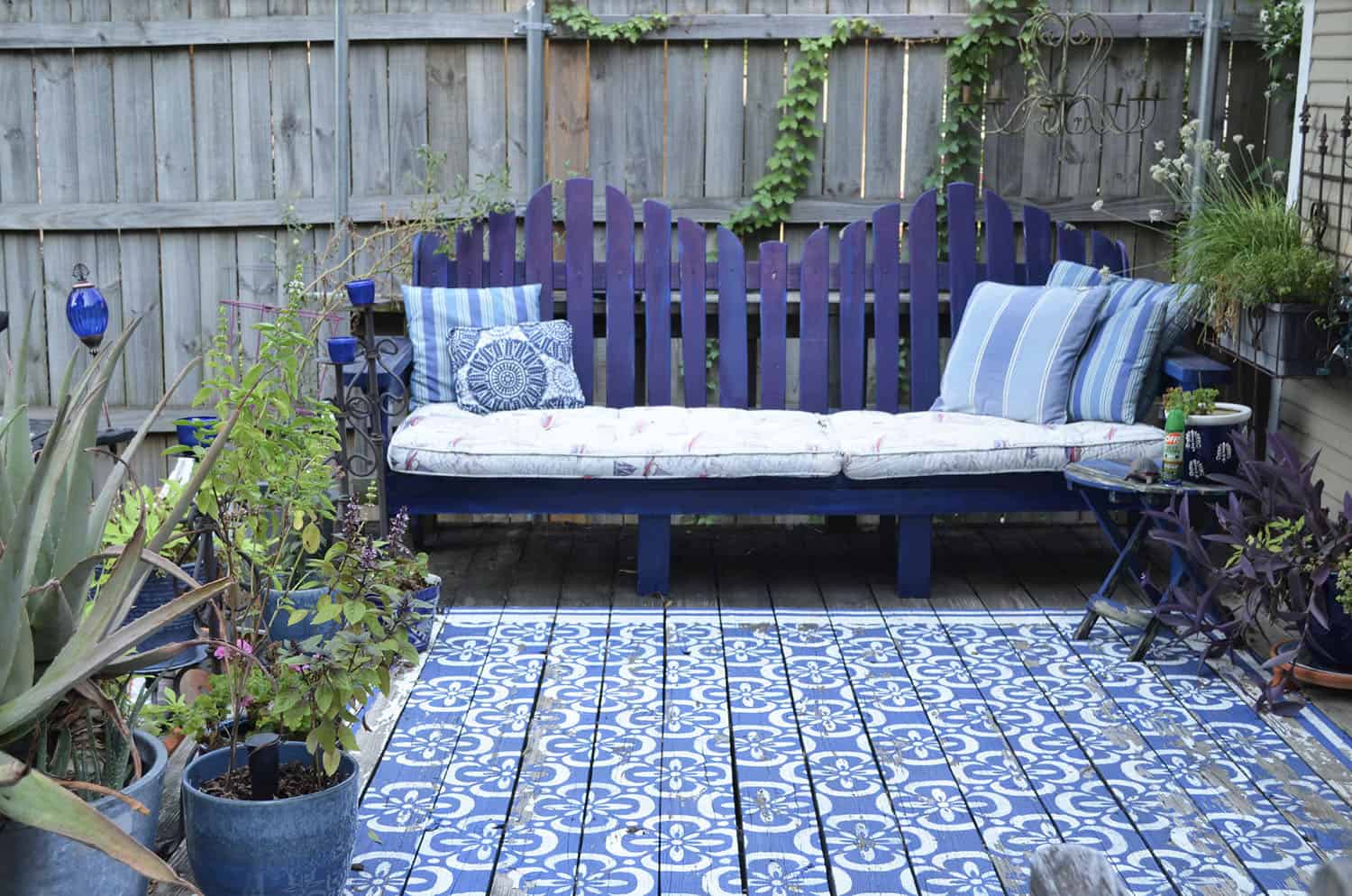 backyard patio with a stencil design on the wood floor