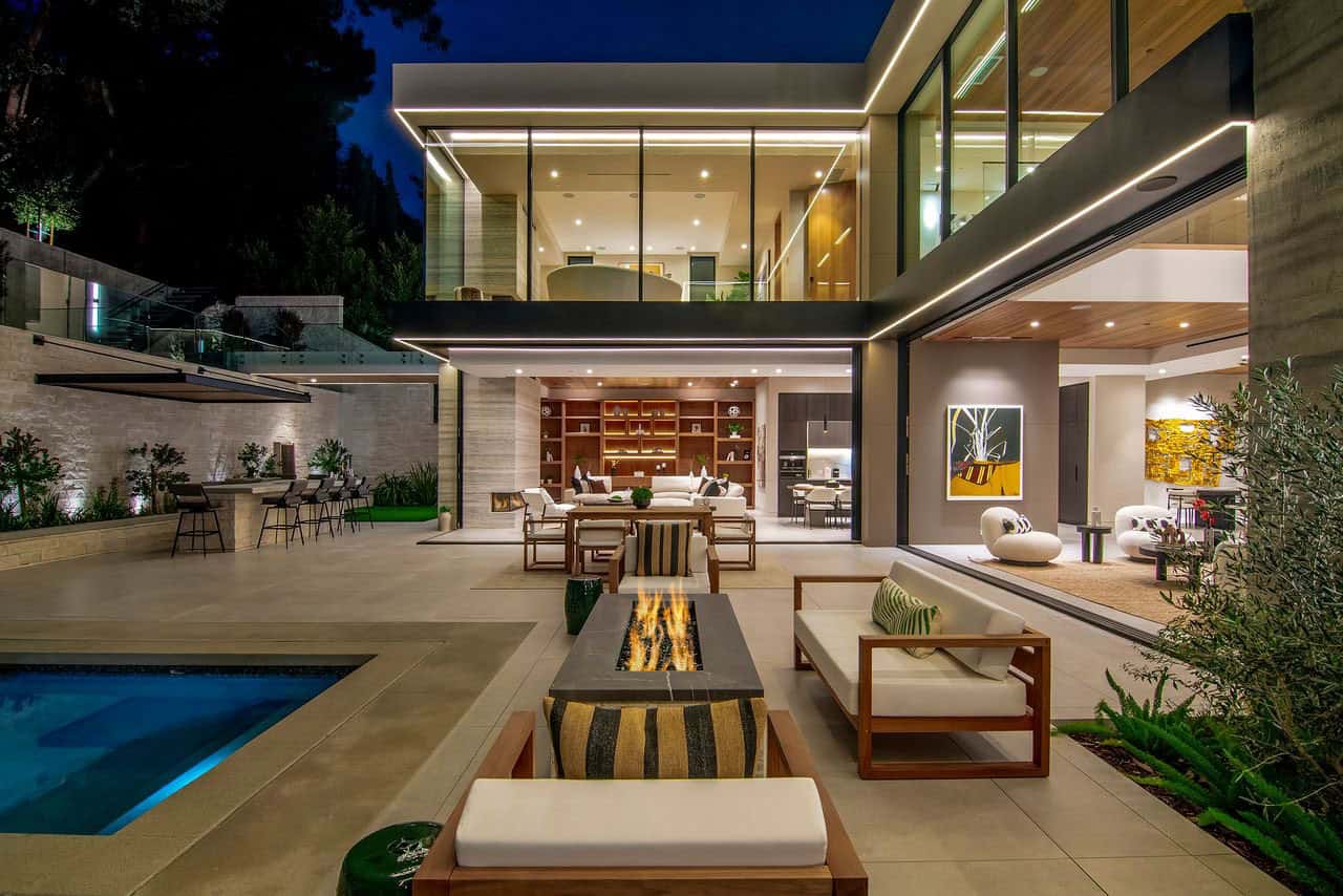 modern home exterior patio with a fire pit and outdoor furniture