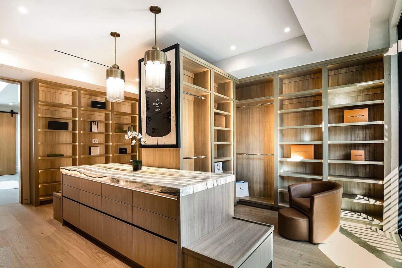 modern walk-in closet with an island