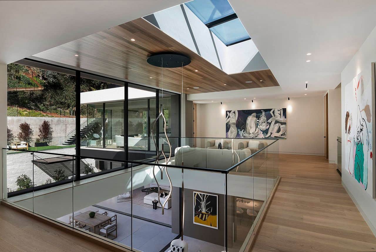 modern upper-level staircase landing with a skylight