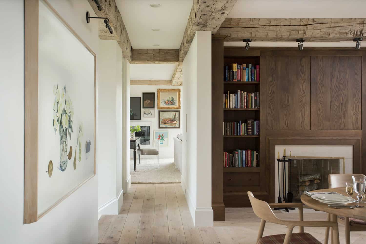 farmhouse style dining room with built-in bookshelves