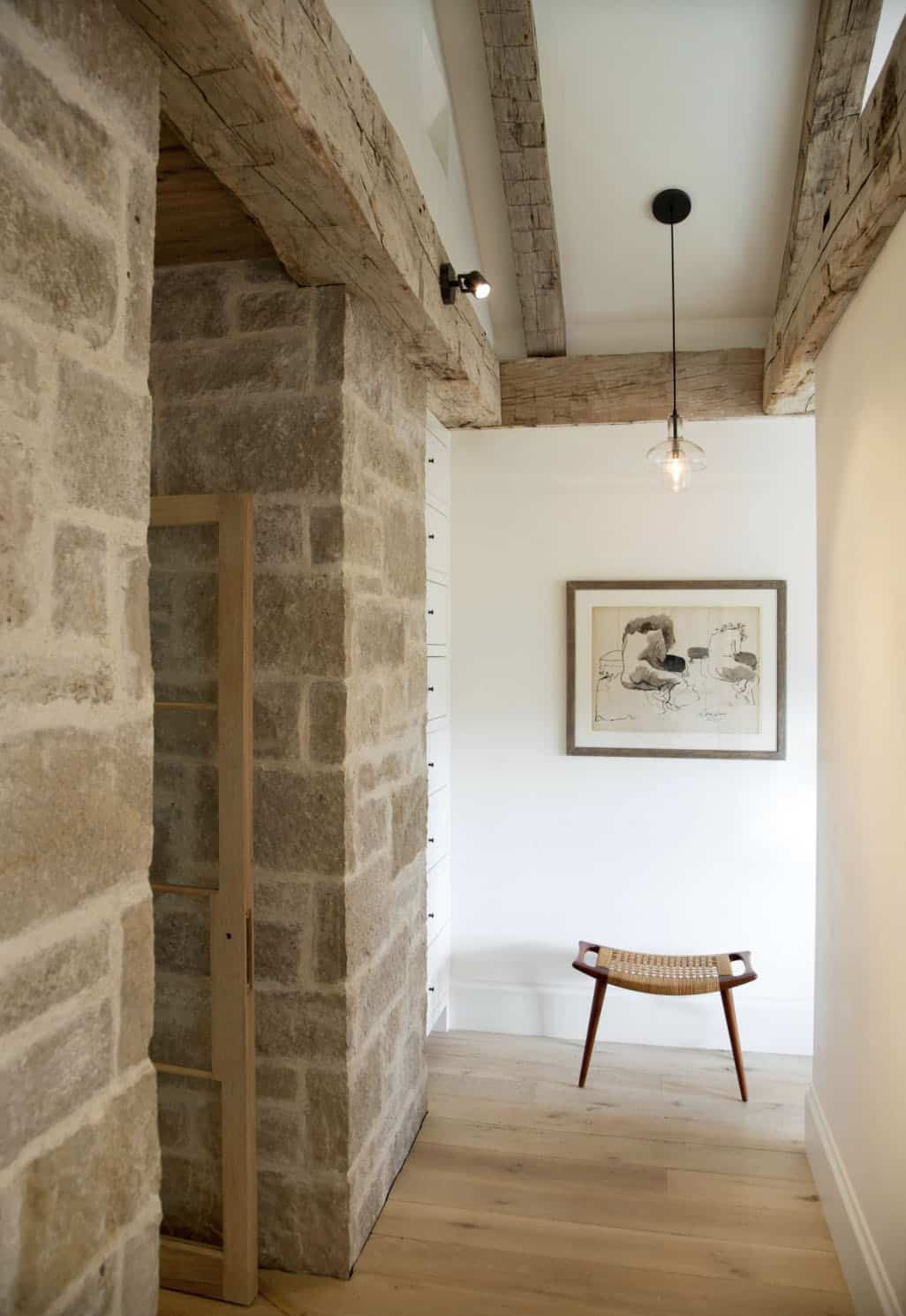 farmhouse style hallway with stone walls