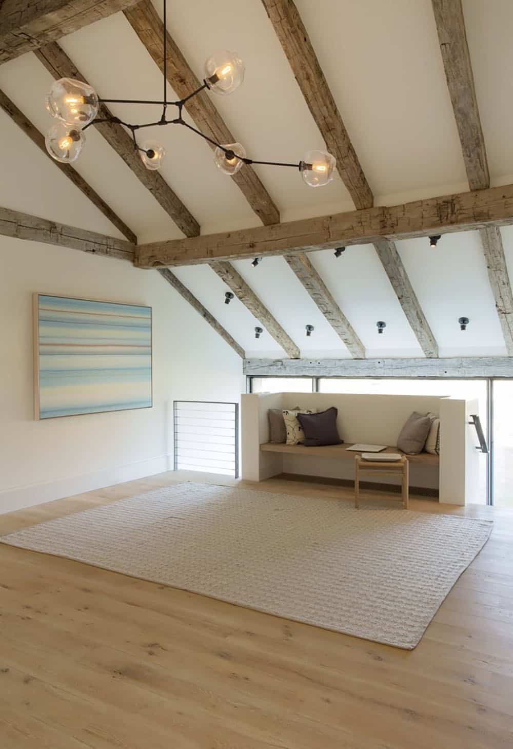farmhouse style upstairs landing with a vaulted ceiling