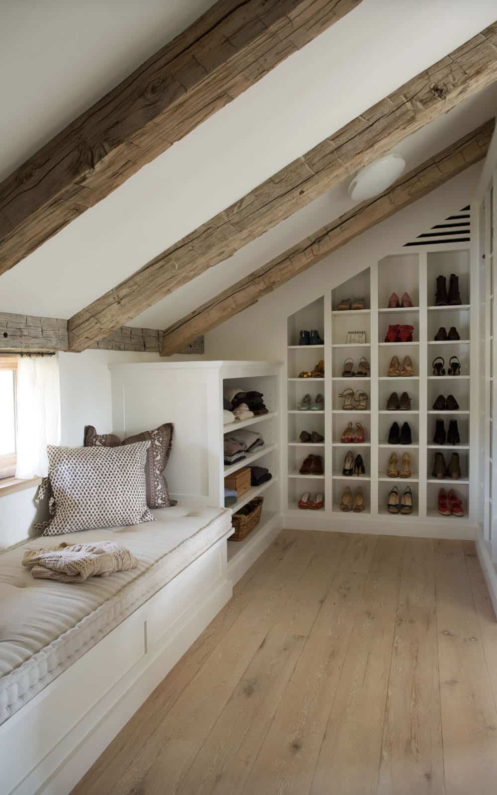 farmhouse style closet with built-in window seat and storage cubbies
