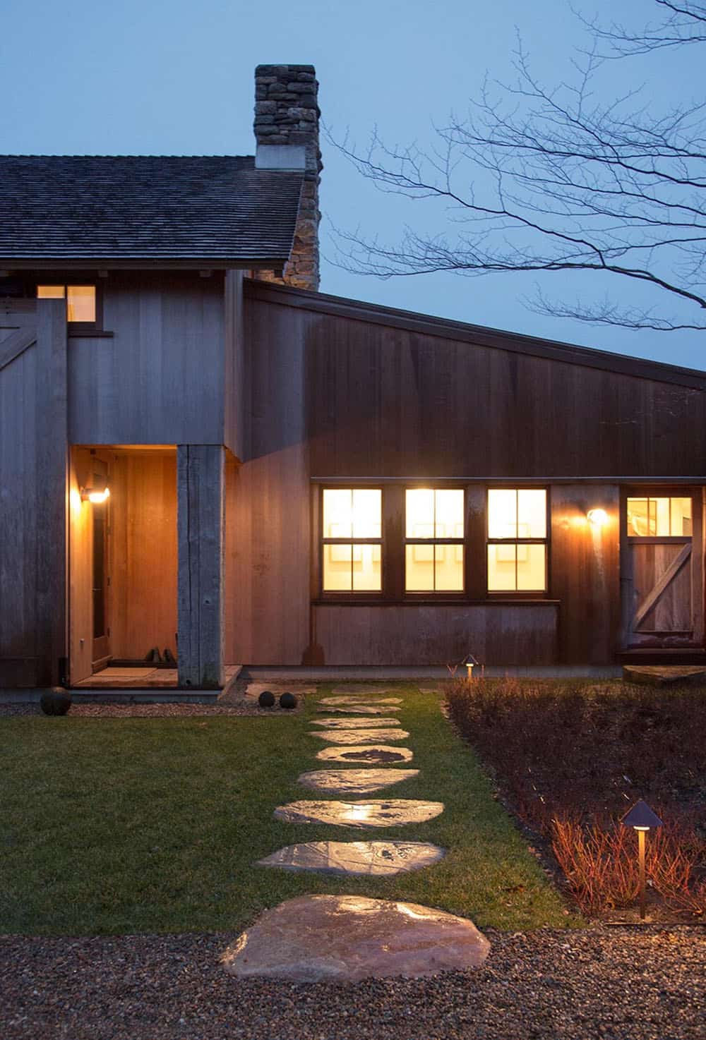 modern barn house exterior at dusk