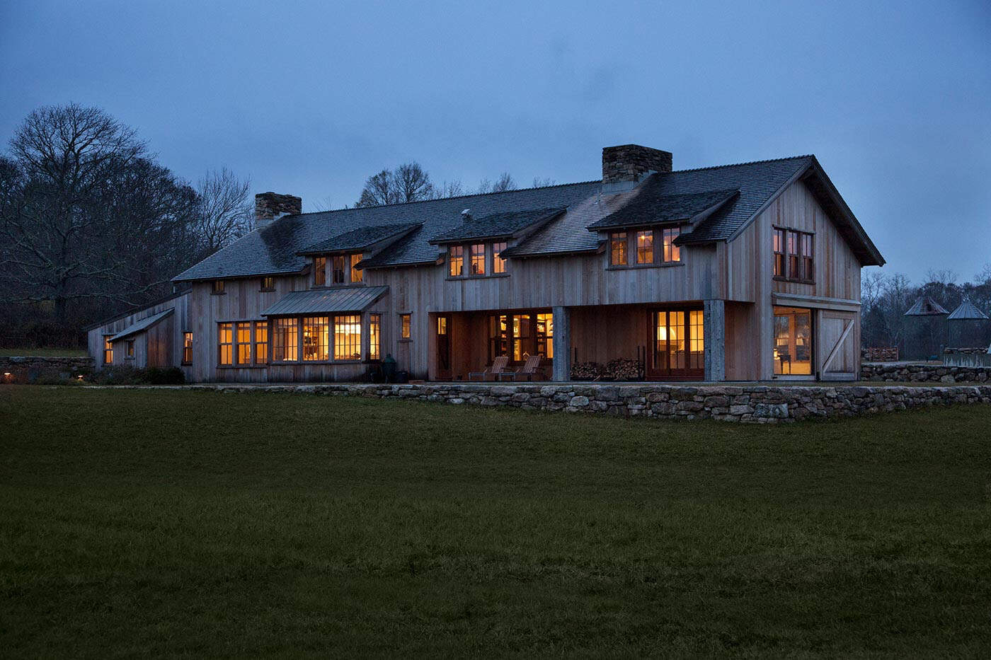 modern barn house exterior at dusk