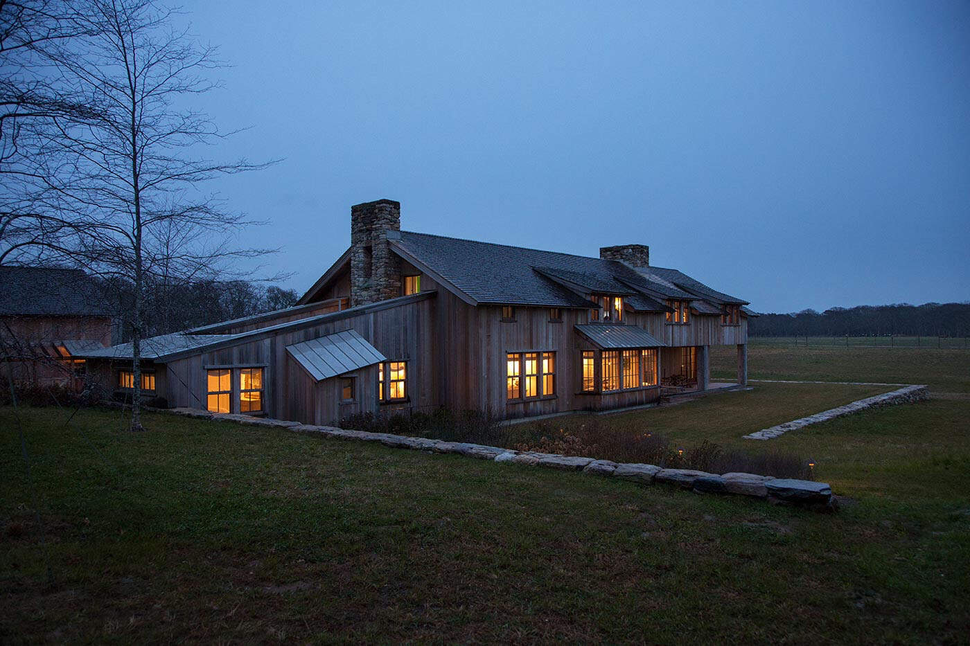 modern barn house exterior at dusk