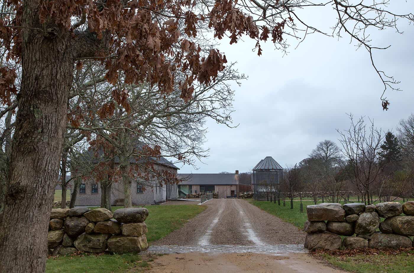 modern barn house exterior with a long driveway