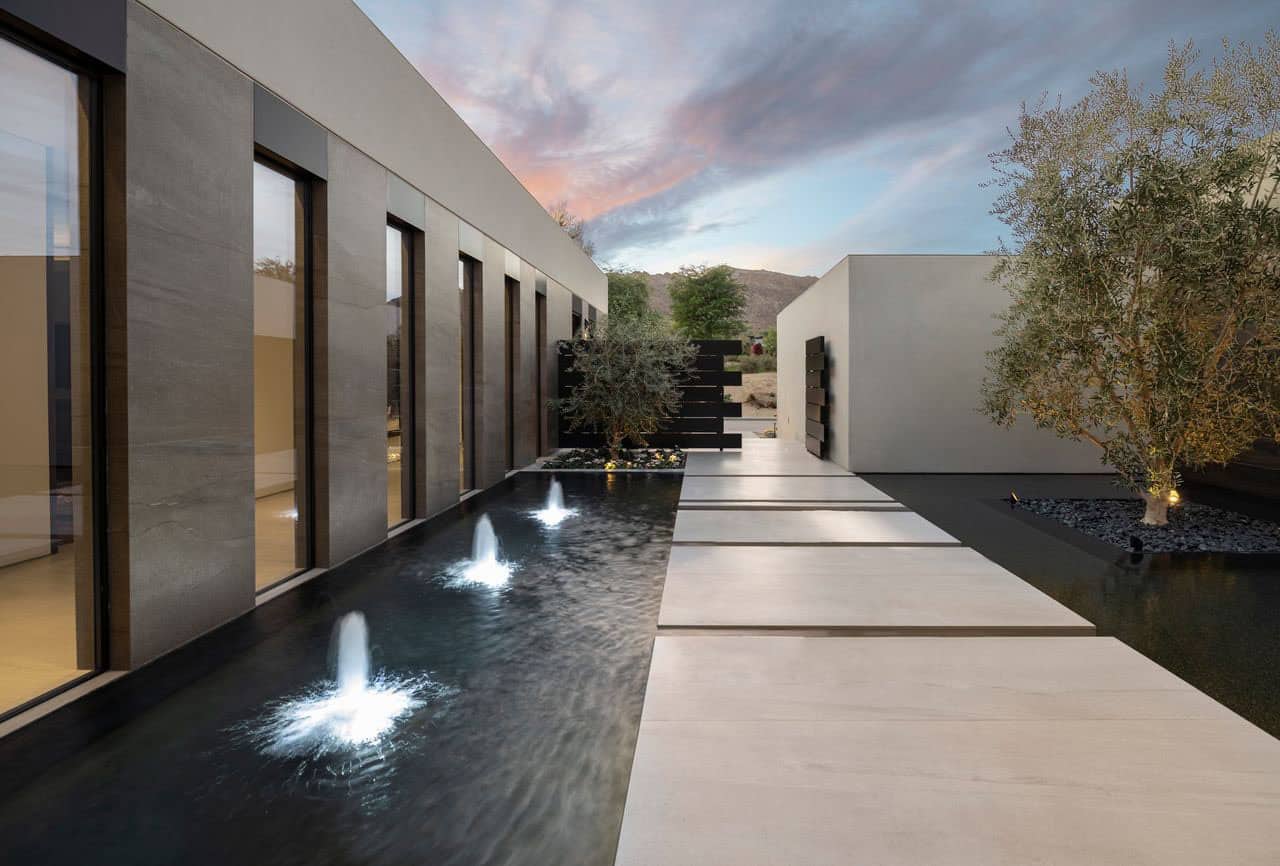 modern desert house exterior with a water feature