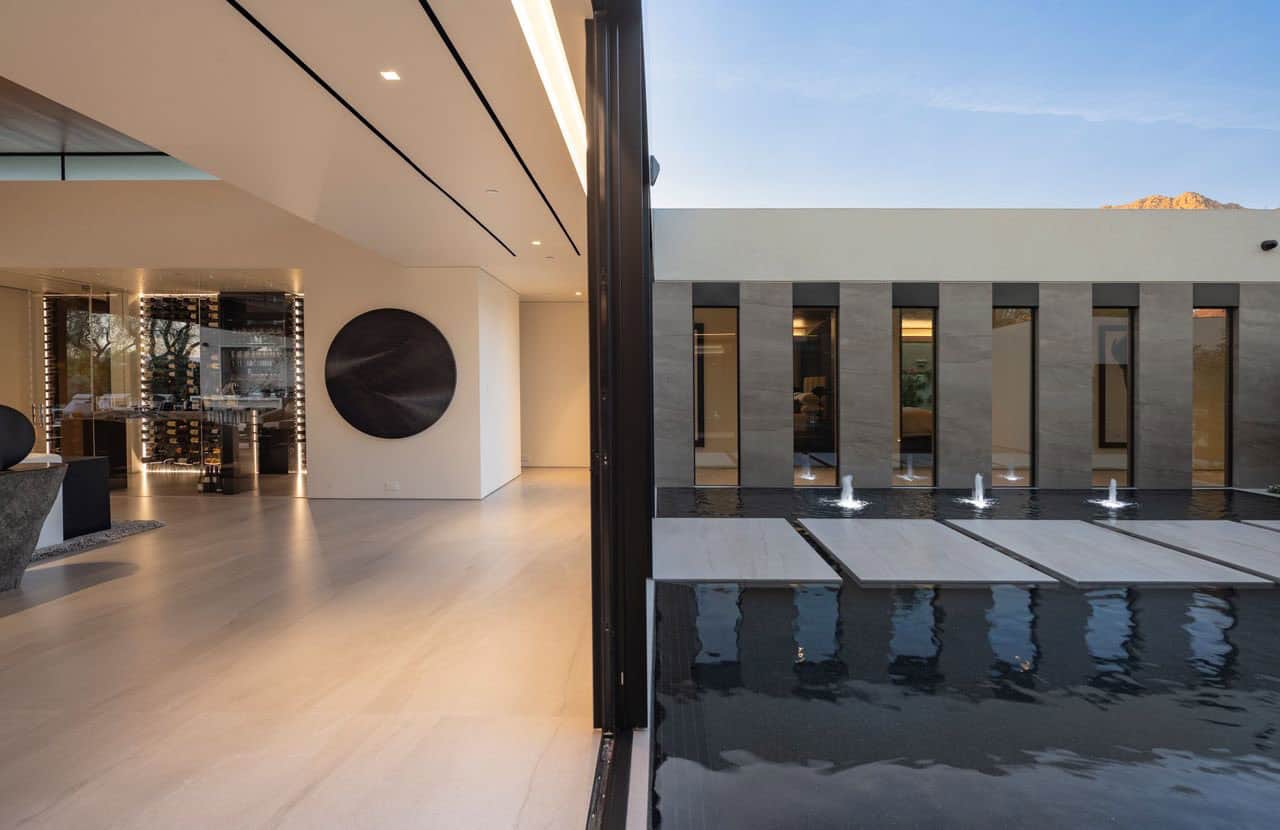modern desert house exterior with a water feature