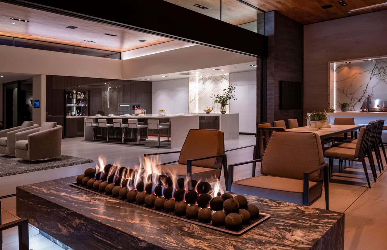 modern covered patio with a fire table