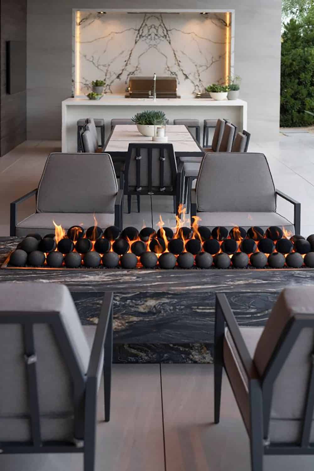 modern covered patio with a fire table