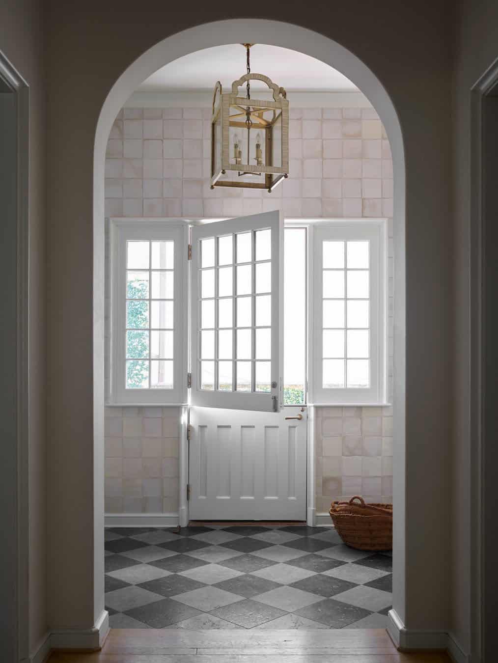 modern english tudor style home entry with a dutch door