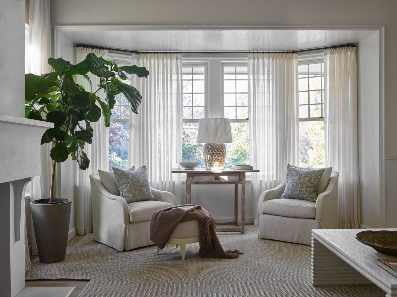 transitional style keeping room with a large window