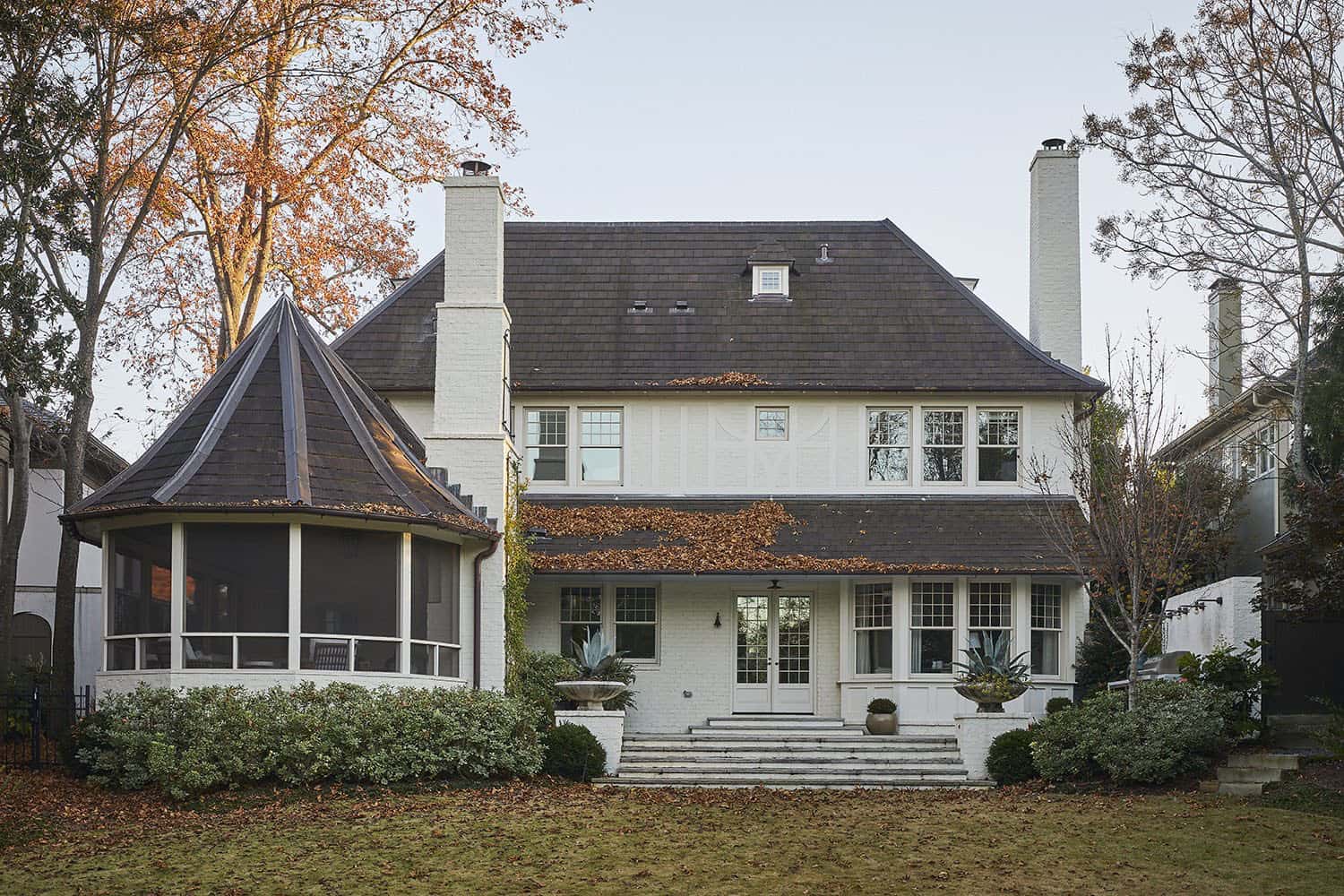 modern english tudor style home exterior backyard view