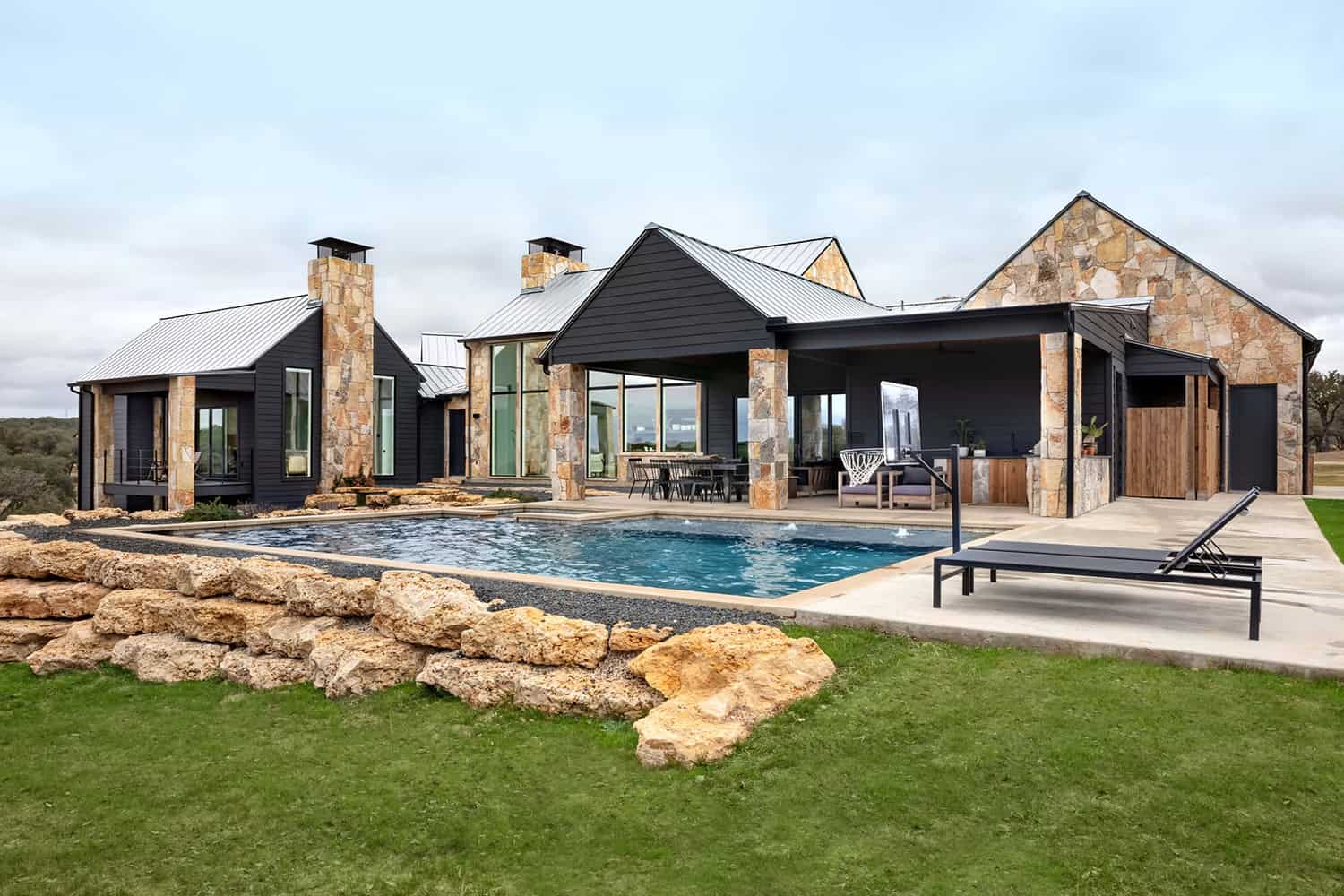 modern farmhouse exterior backyard view with a pool