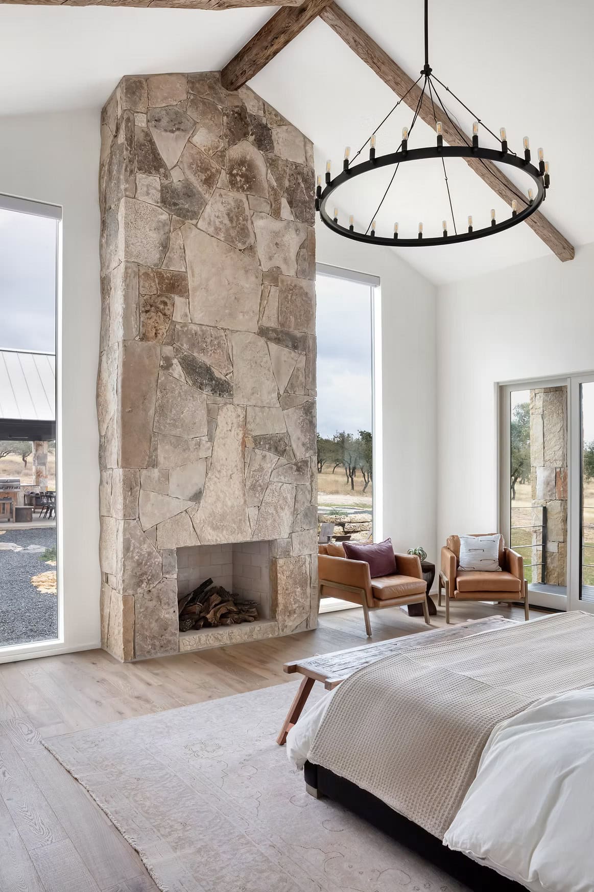 modern farmhouse style bedroom with a fireplace