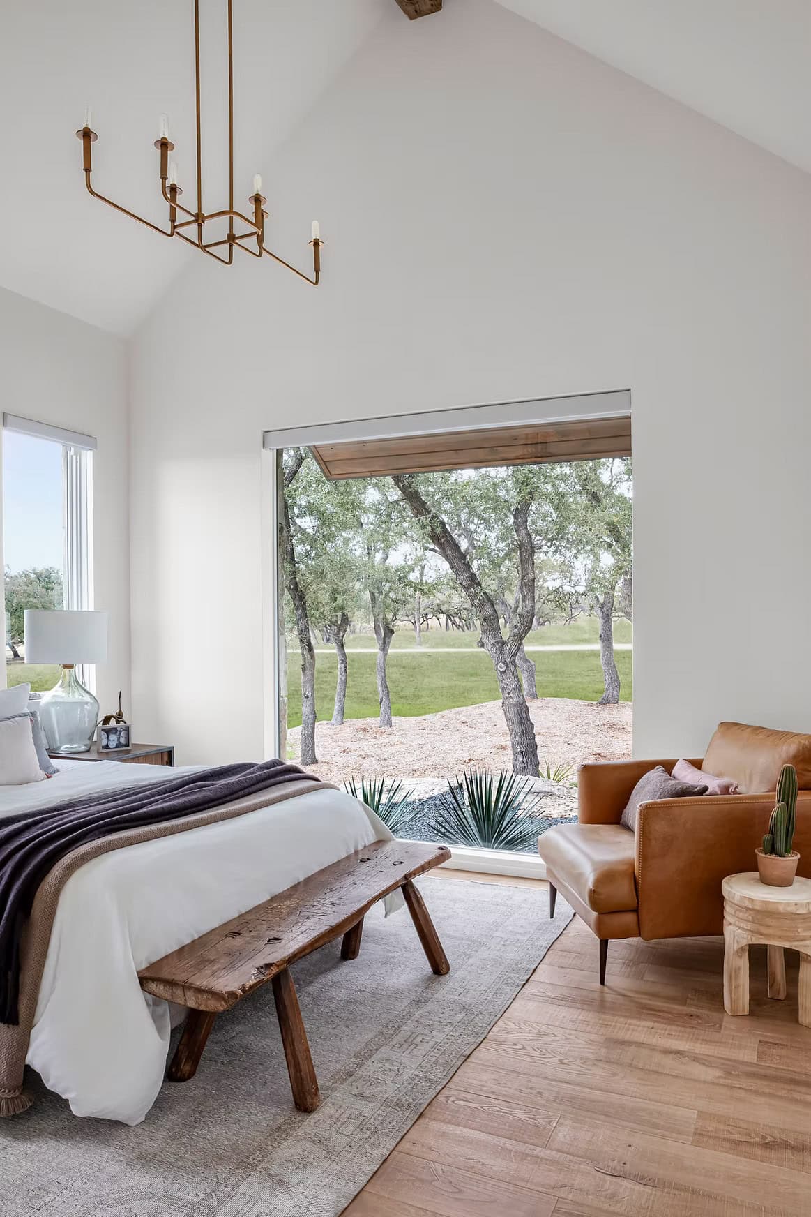 modern farmhouse style bedroom with a large window
