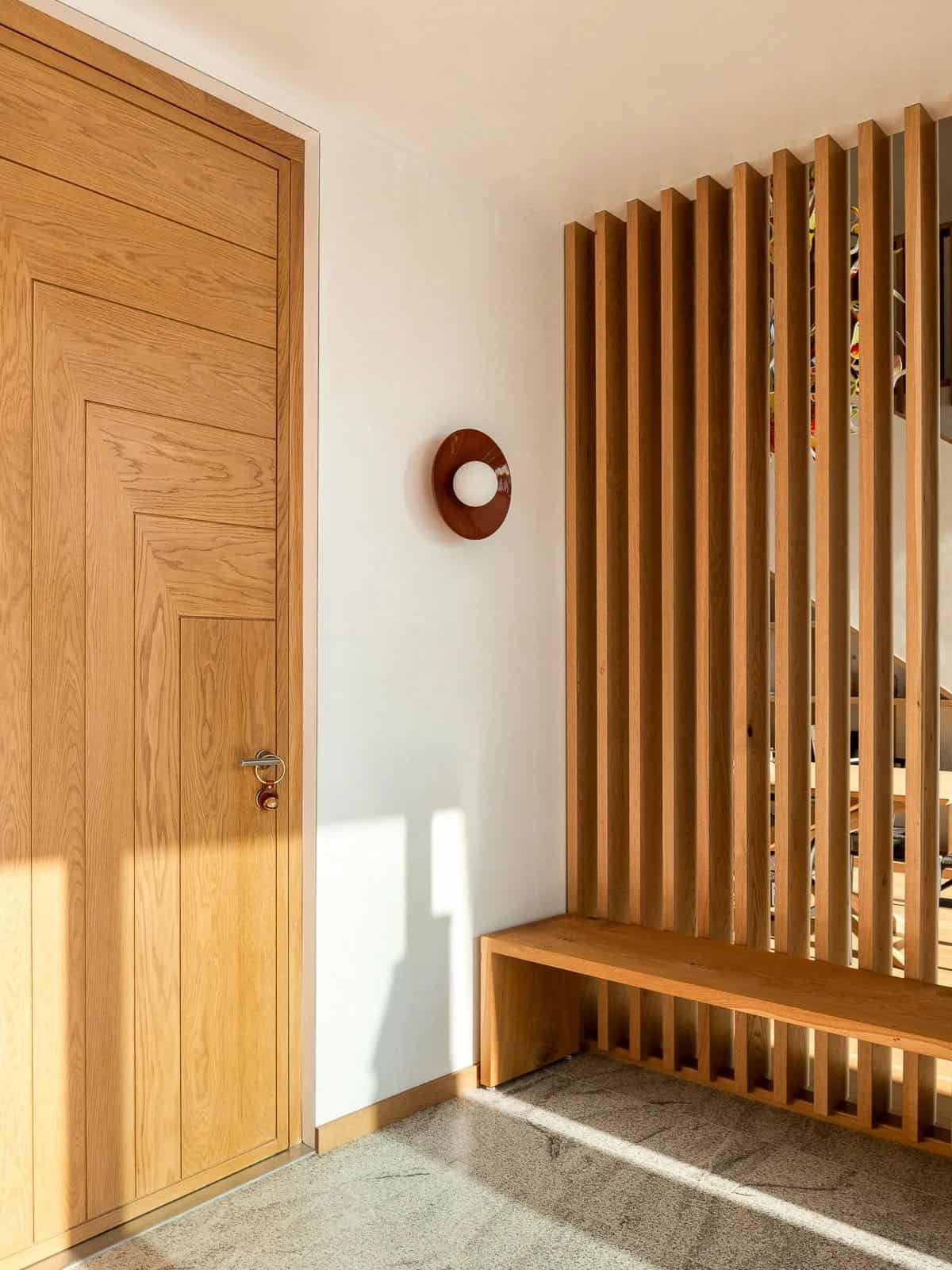 modern lake house entry with a built-in bench