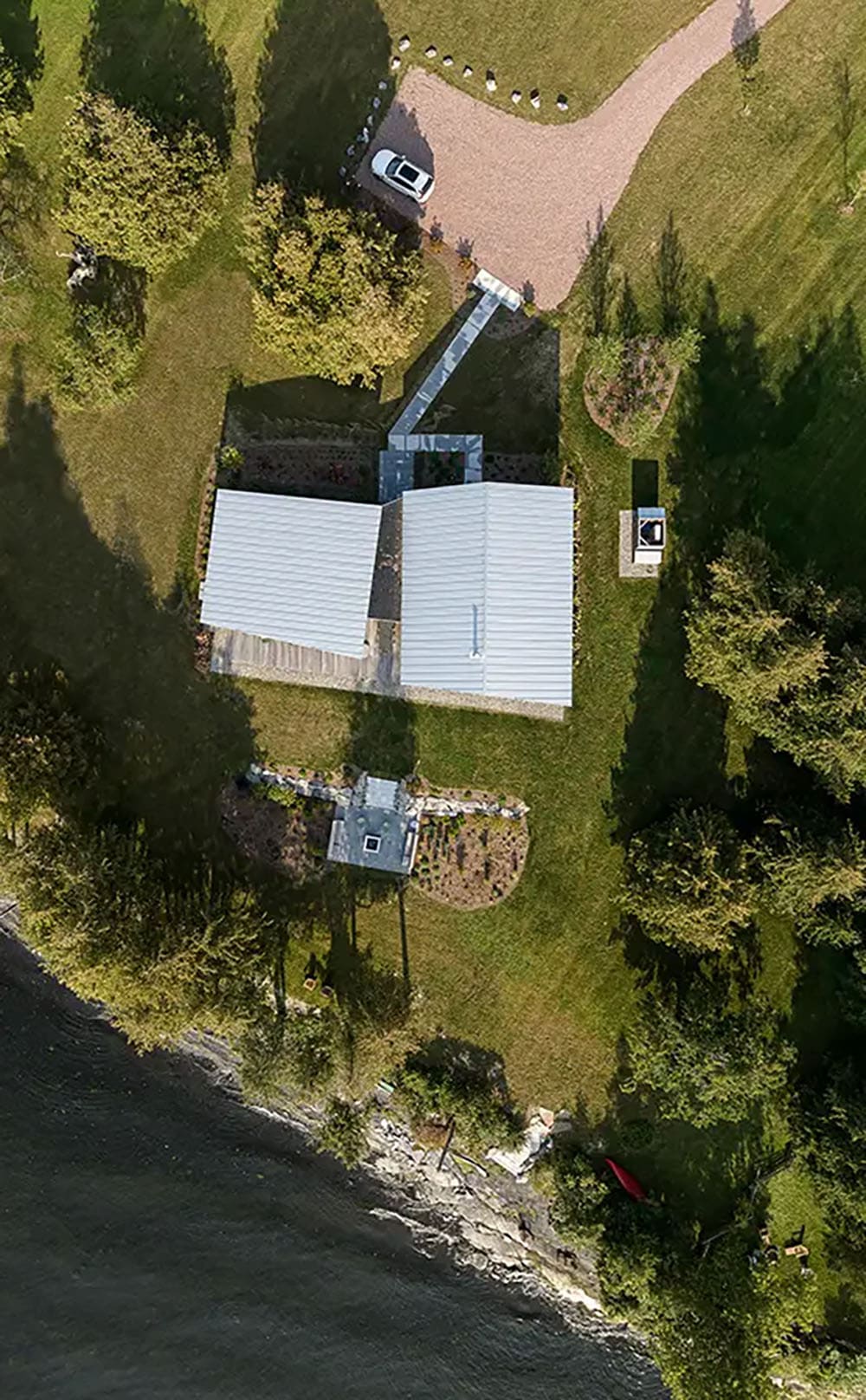 modern lake house exterior aerial view