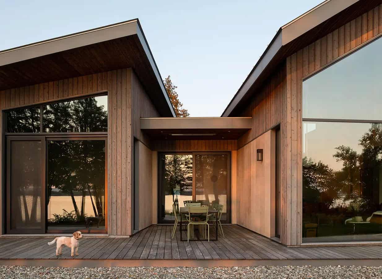 modern lake house exterior at dusk