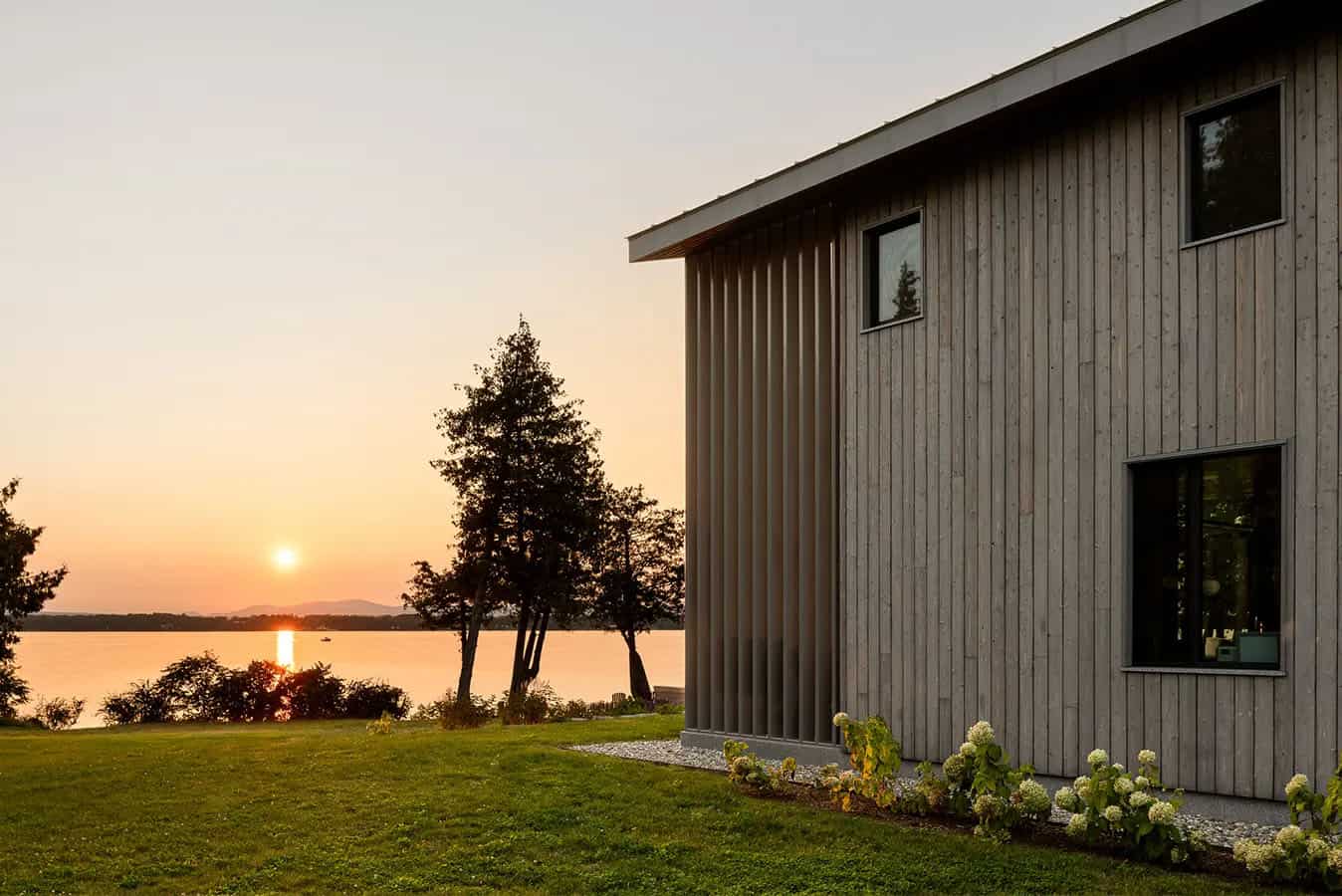 modern lake house exterior at dusk